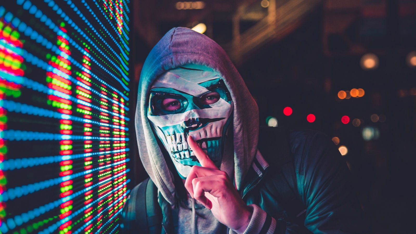 Hacker in mask symbolizing Raspberry Pi ATM heist by LightBasin
